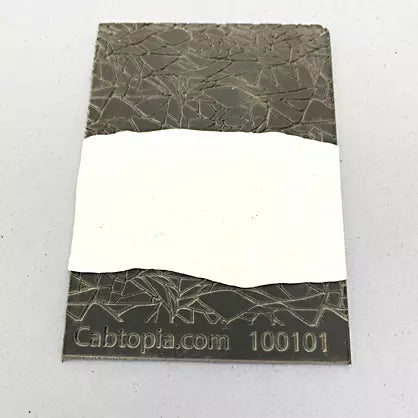 photo shows clay pressed firmly into stamp 