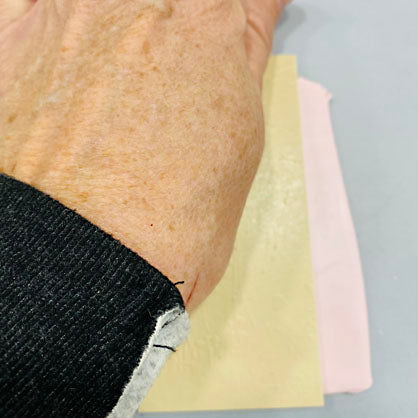 photo shows pressing hand onto texture sheet