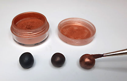 3 black balls of Sculpey Souffle polymer clays brushed with bronze mica powder