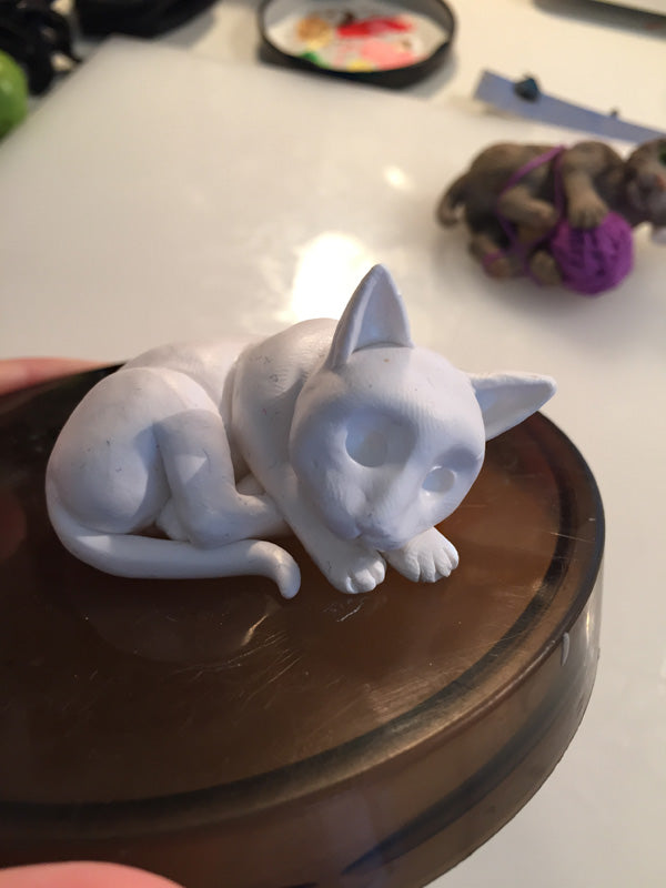 add ears to sleeping clay cat