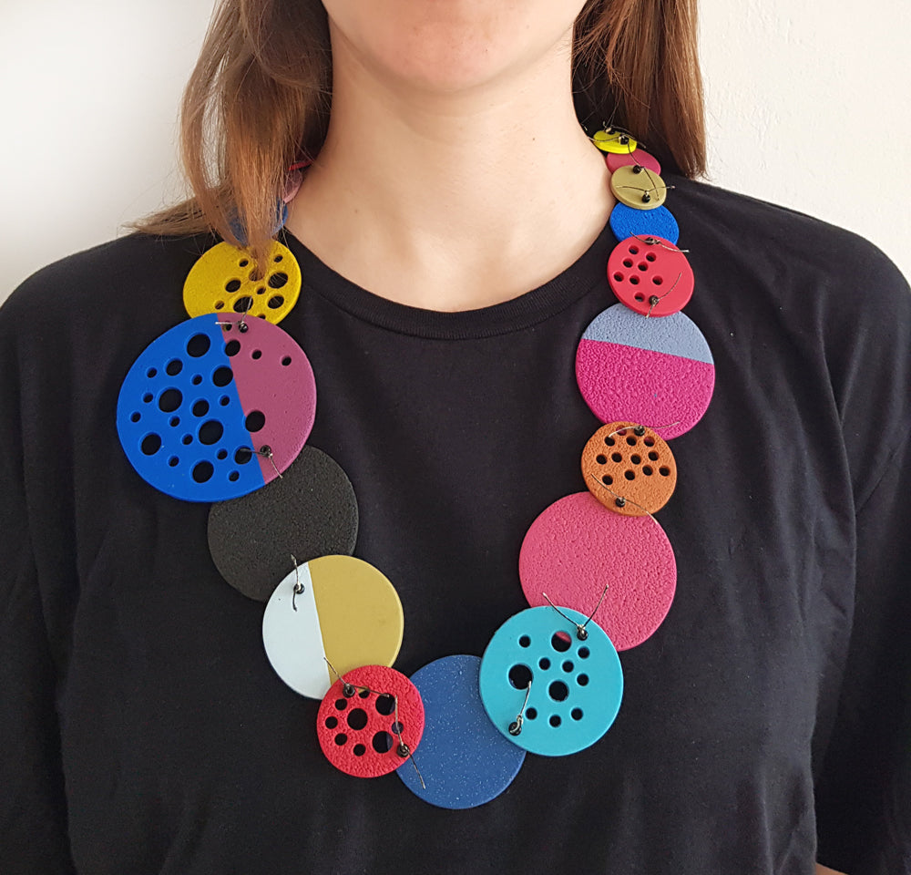 women wearing large color pop necklace made of polymer clay