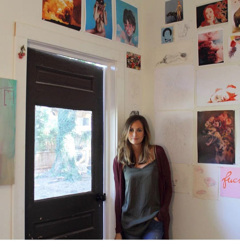 Brunette woman standing in an art studio