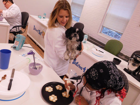 students learning to decorate dog treats