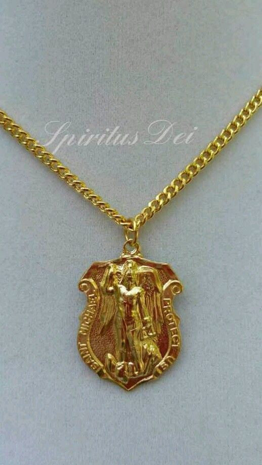 gold st michael pendant police