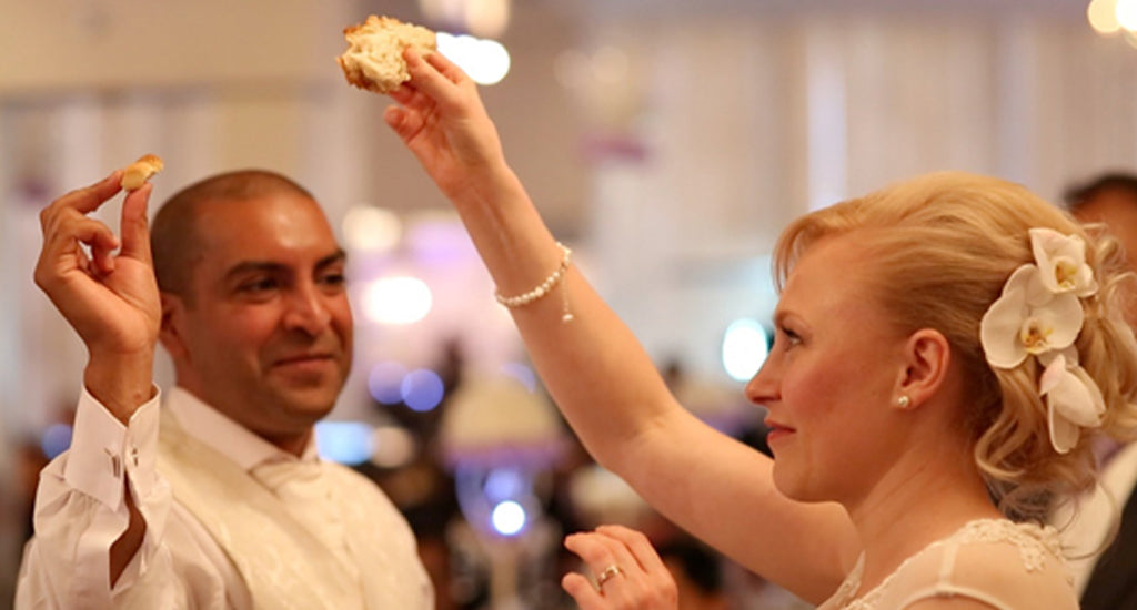 Russian married couple sharing karavaya bread - Shimansky