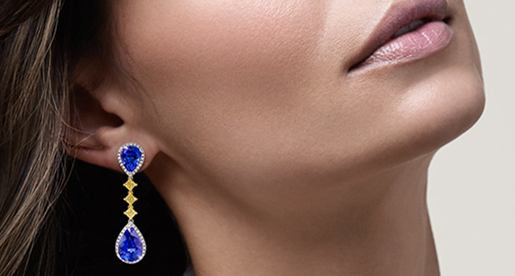 Woman wearing tanzanite drop earrings