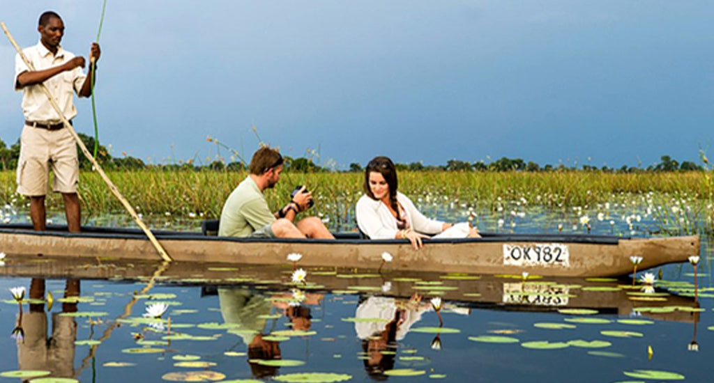 Couple enjoying the Mokoro ride in Botswana