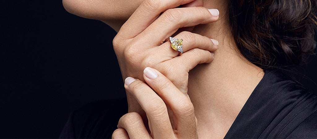 Woman wearing a Shimansky Fancy Yellow Diamond ring