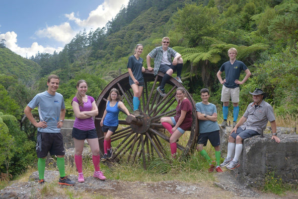 Group wearing txg compression socks and sleeves