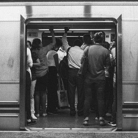 People commuting to work on a train