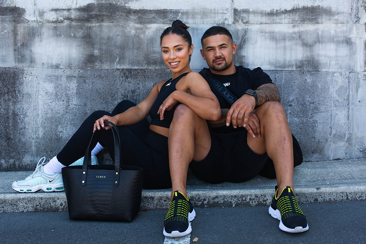 Amber Reid with her partner Willis from the Cobalt Club sit together in urban background