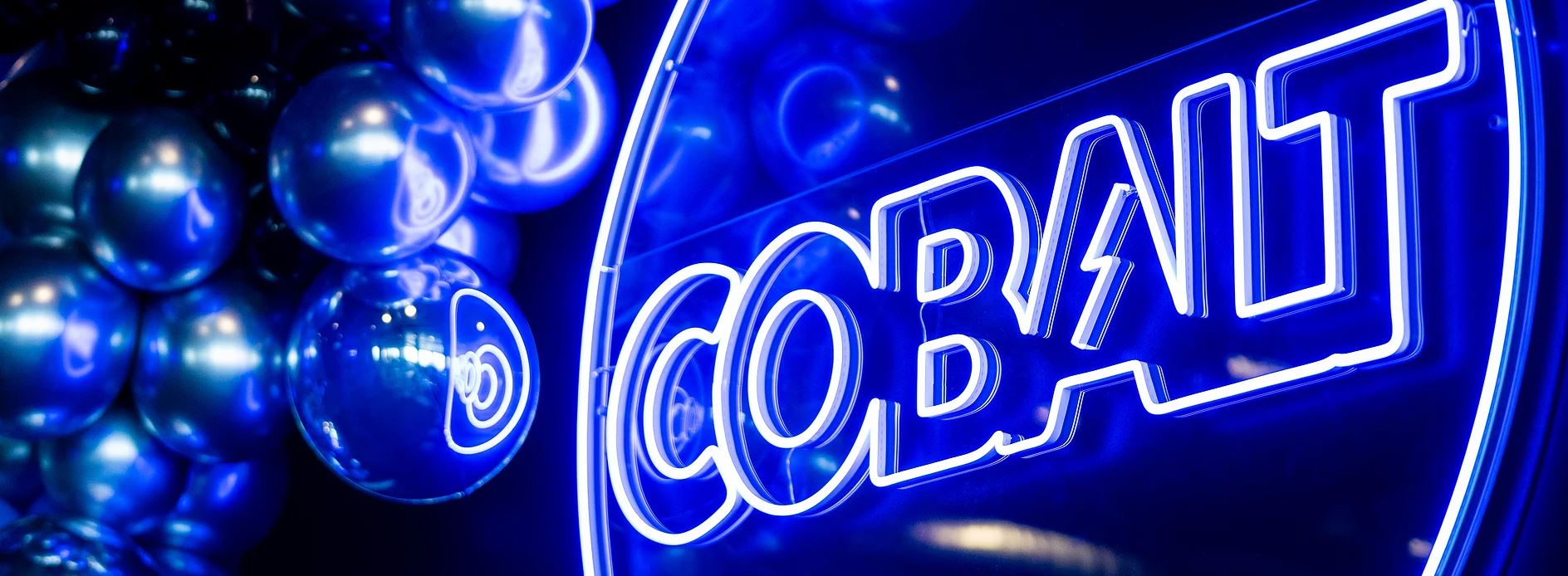 Cobalt Club gym logo in neon on the wall