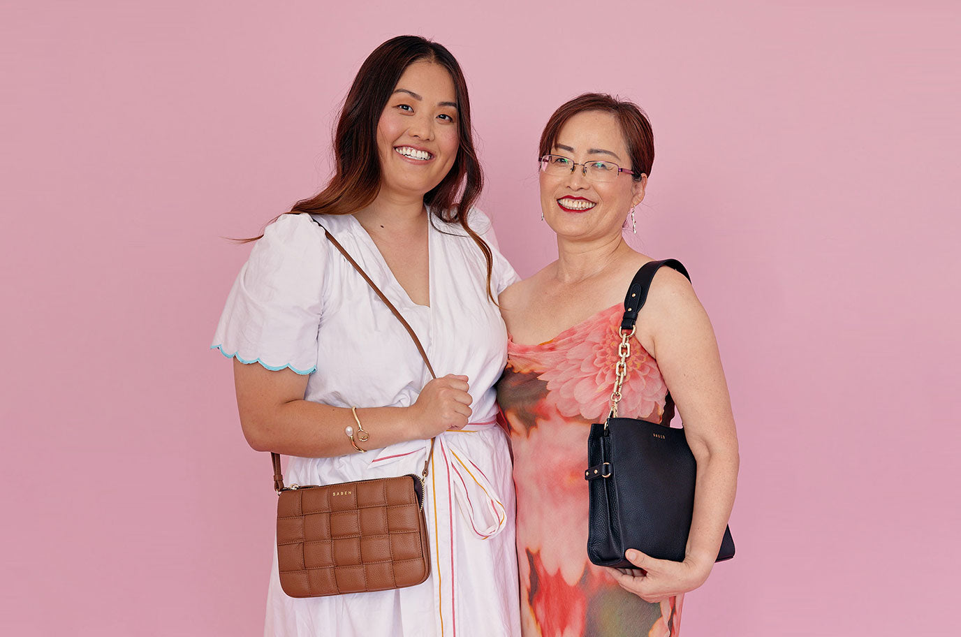 saejung and mum sonia wearing Bea black and big sis tilly tan woven for saben mothers day campaign