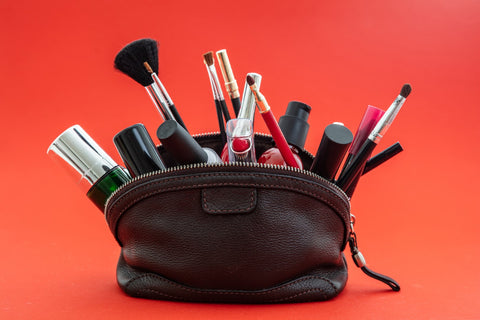 black makeup bag with products