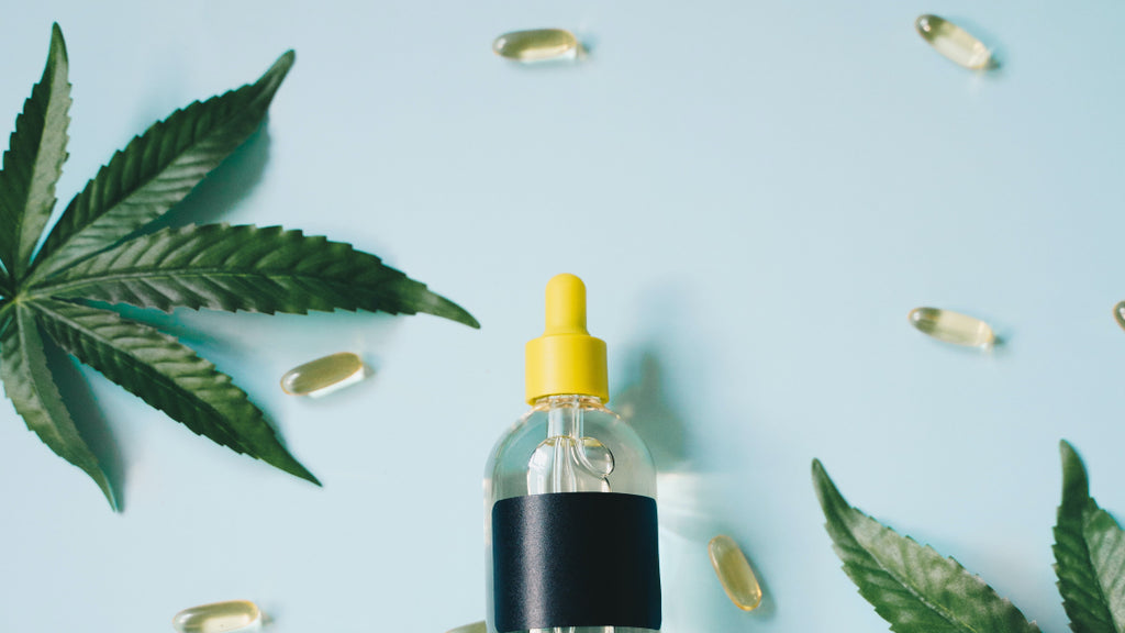 Unlabeled oil tincture with marijuana leaves 