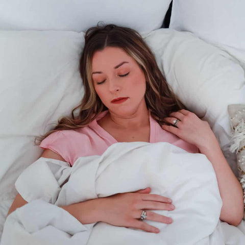 Woman sleeping better with Go Botanicals Sleep Gummies