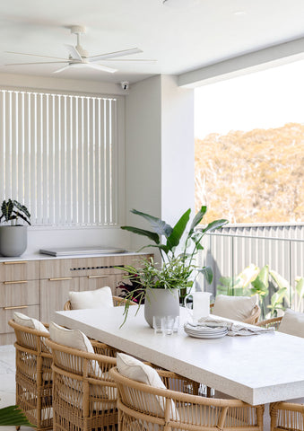 Chic dining area with natural light featuring Slugg planters with indoor greenery, complementing the modern home decor