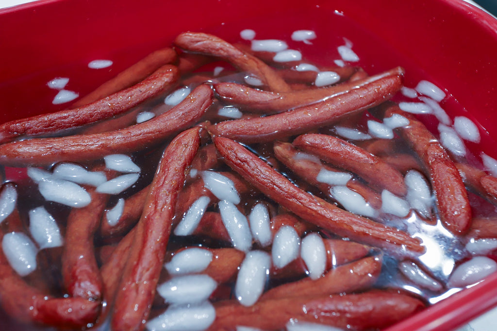 hot dog sausages in iced water