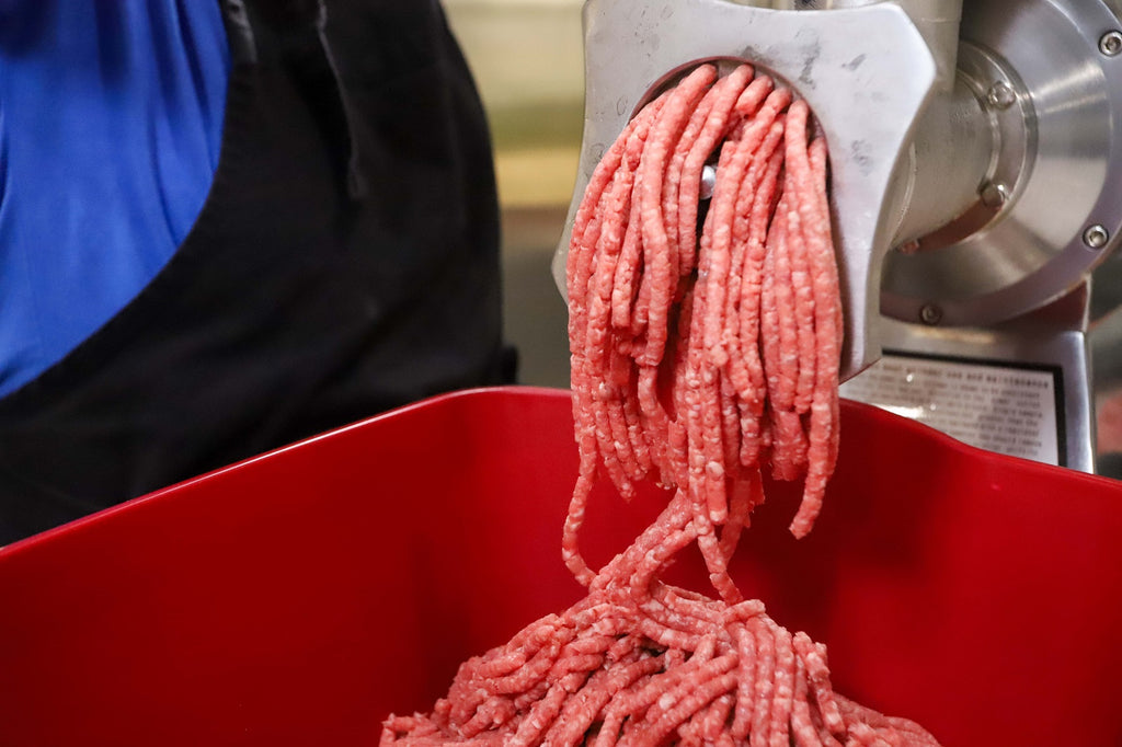 second round of hot dog meat grinding to prepare well mixed sausages