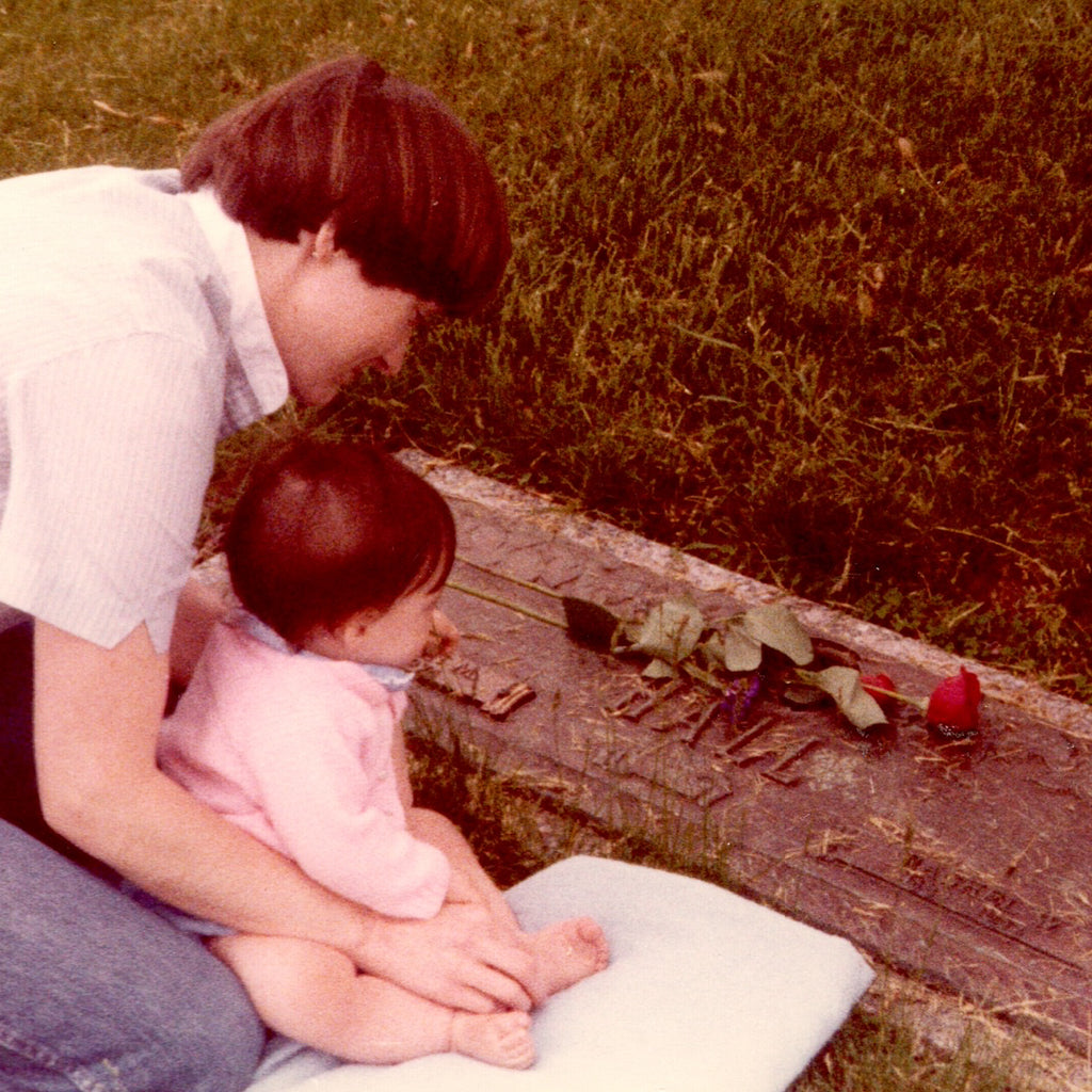 The author Rachel Kroh as a baby with her mother Betsy at her great grandmother Rachel's grave.