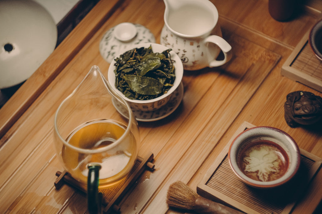 Tea In Teapot With Tea Cups On Table