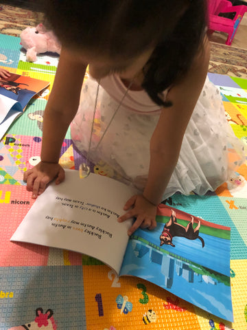 Girl reading copy of "Meet Buckley"