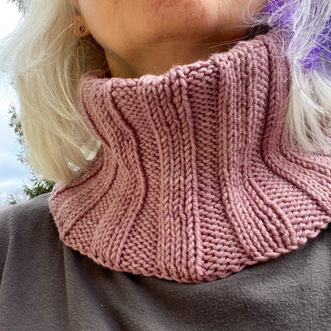 A ribbed cowl made of naturally dyed organic worsted weight yarn