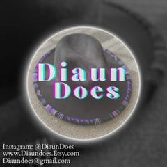 An image of a black fedora with purple sections of beadwork on the rim of the hat. A very light purple text reads "Diaun Does" overlaying the hat. The image is cropped in a circle with a black background. The bottom left corner has the following contact information "Instagram: @DiaunDoes www.Diaundoes.etsy.com diaundoes@gmail.com"