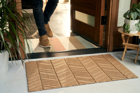 Two mat system featuring a WaterHog Luxe All-Weather Doormat and Neighburly Indoor or Outdoor Doormat