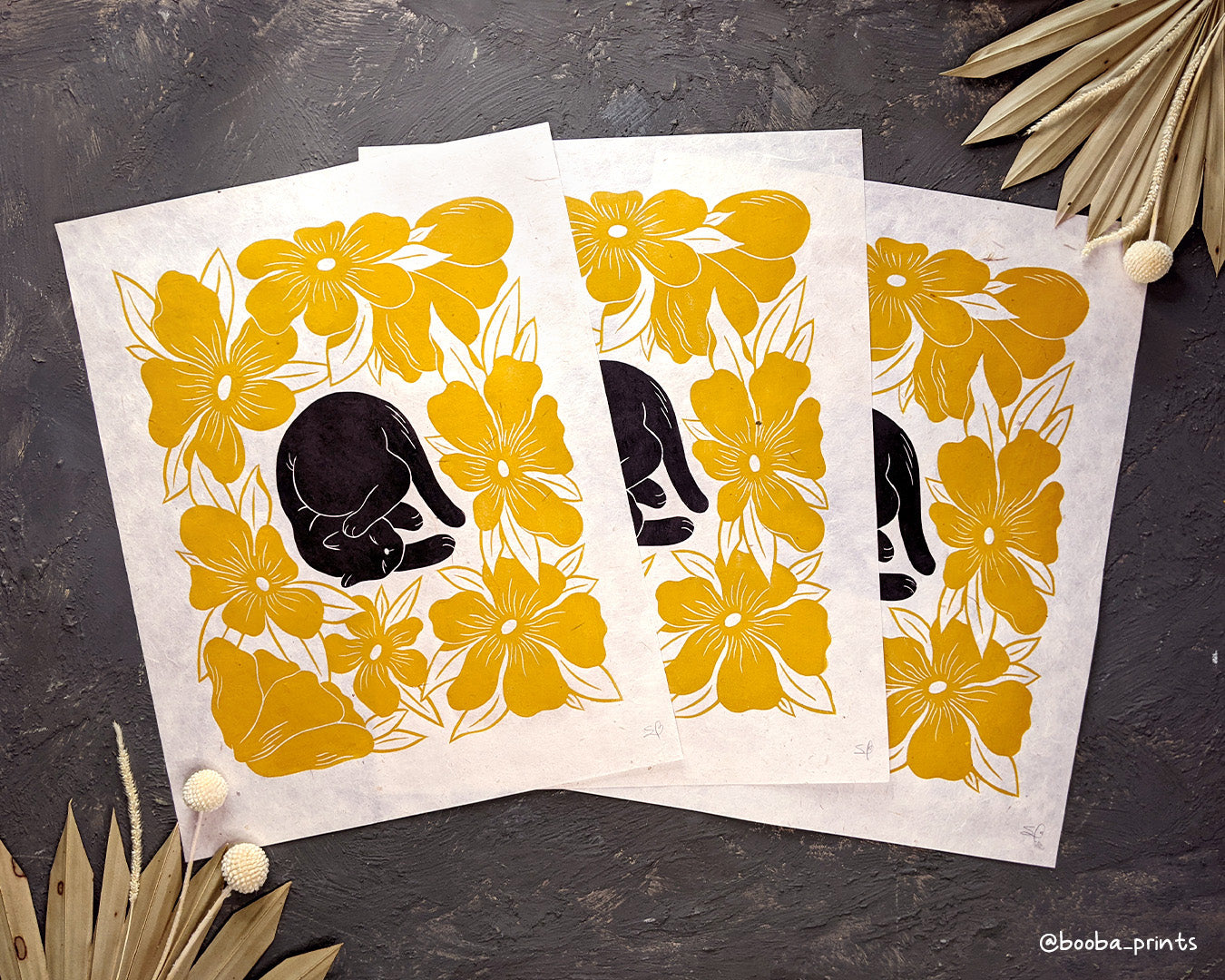 Original art by Booba Prints, made using block printing technique. Lazy Cat print featuring black cat and yellow flowers, a 2 color block print, contemporary art