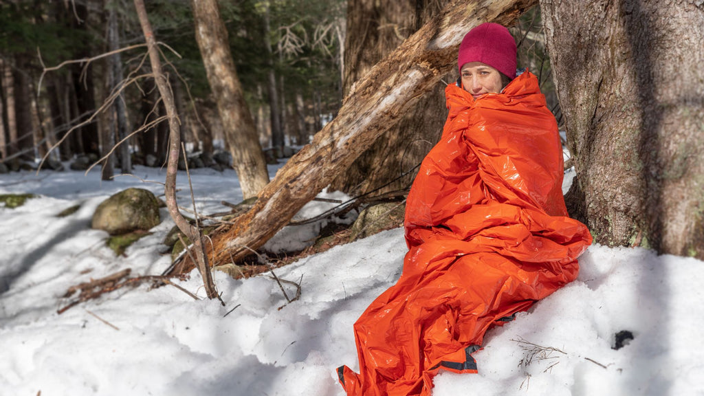 Woman wrapped in emergency bivvy