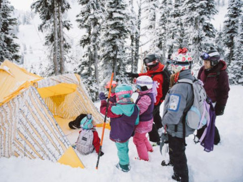 Girls in snow learning wilderness skills