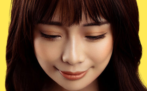 Asian model wearing natural makeup and natural foundation for Asian skin tone. 