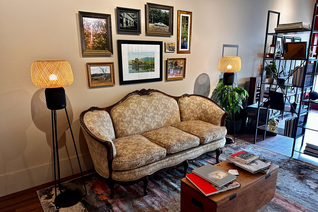 antique couch, warm lighting and displayed photography prints