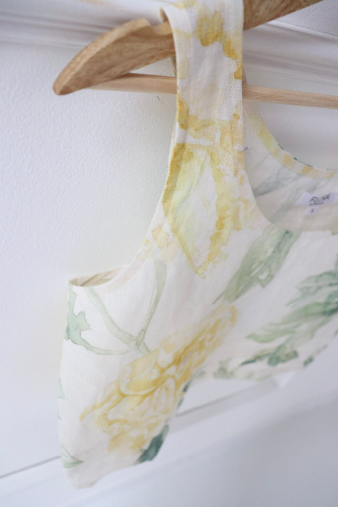 White linen tank top with a soft yellow rose print. Floral print linen tank top.