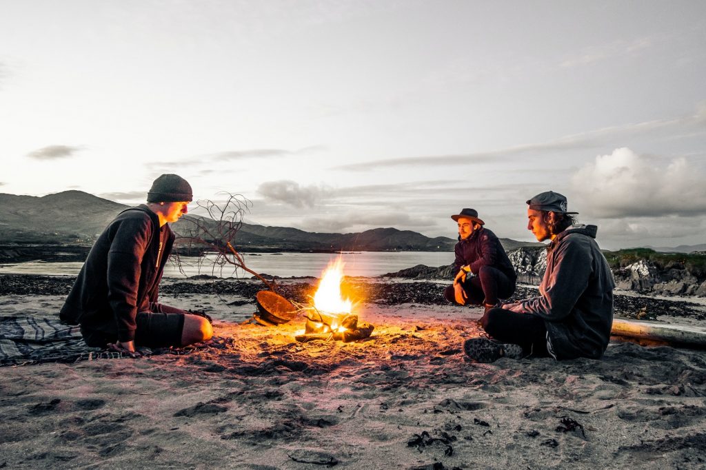 Enjoying the heat of a campfire whilst camping