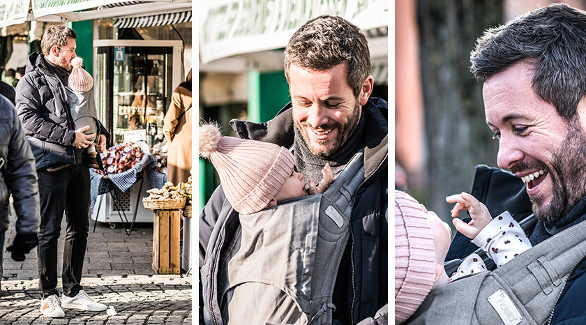 Jan Hartmann visits a weekly market with daughter Emmy in a Fidella baby carrier