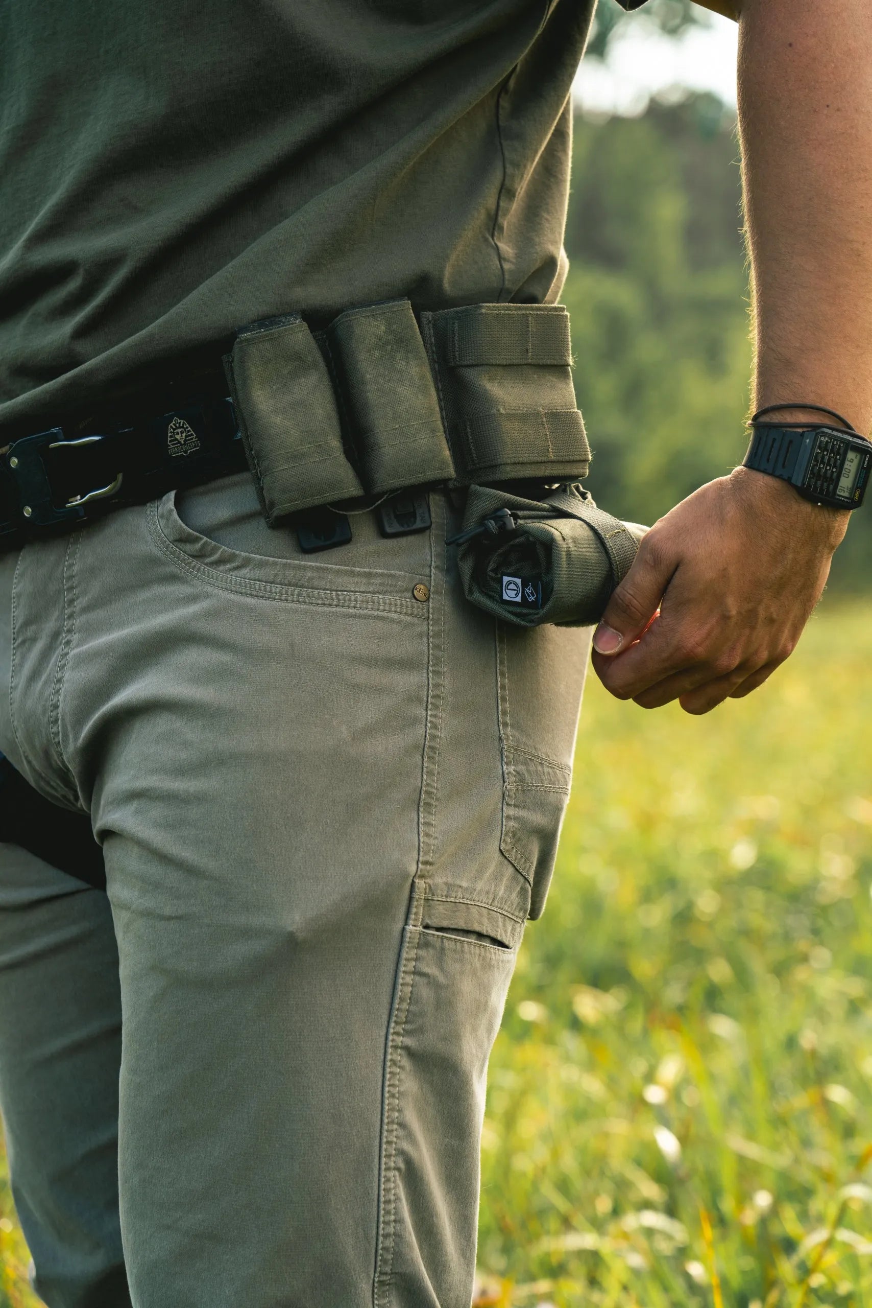 Dump pouch mounted on battle belt next to mag pouches