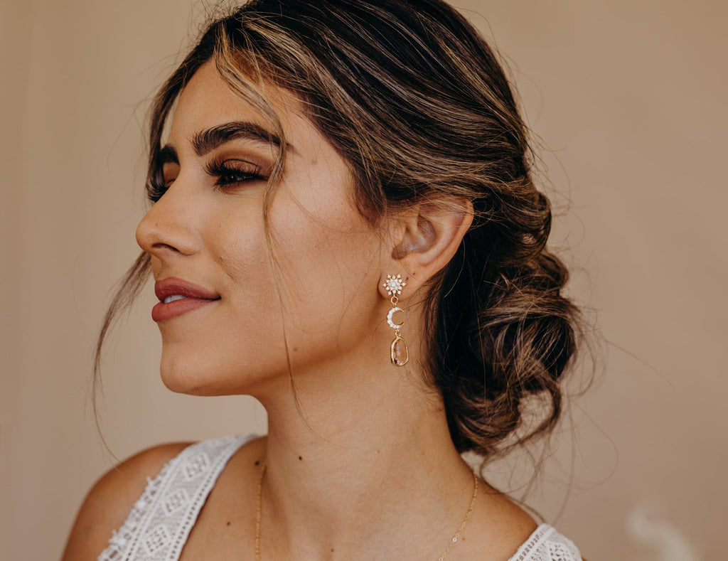 bride wearing crescent moon drop earrings
