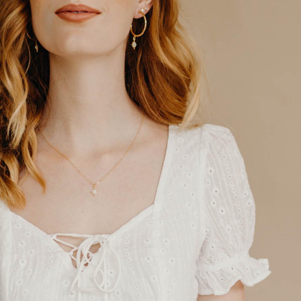 bride wearing a star necklace