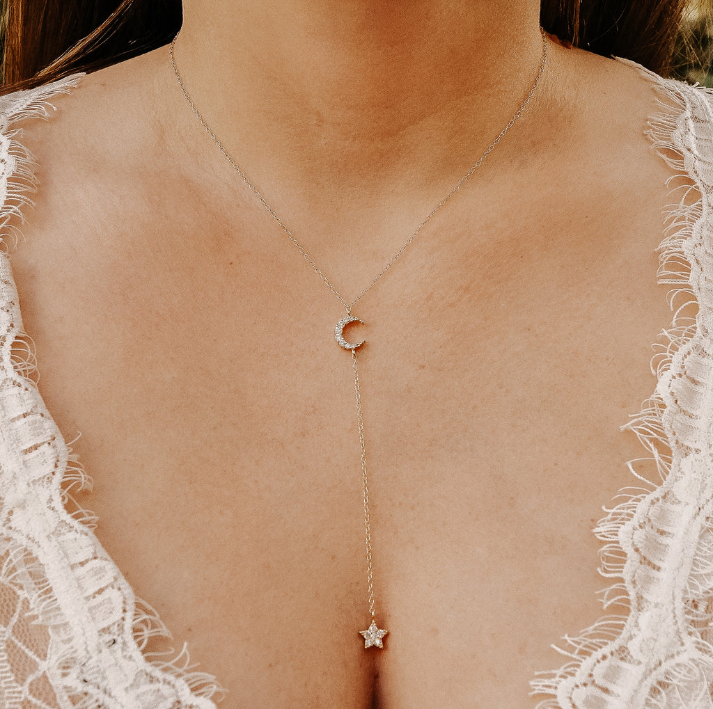 bride wearing crescent moon y necklace