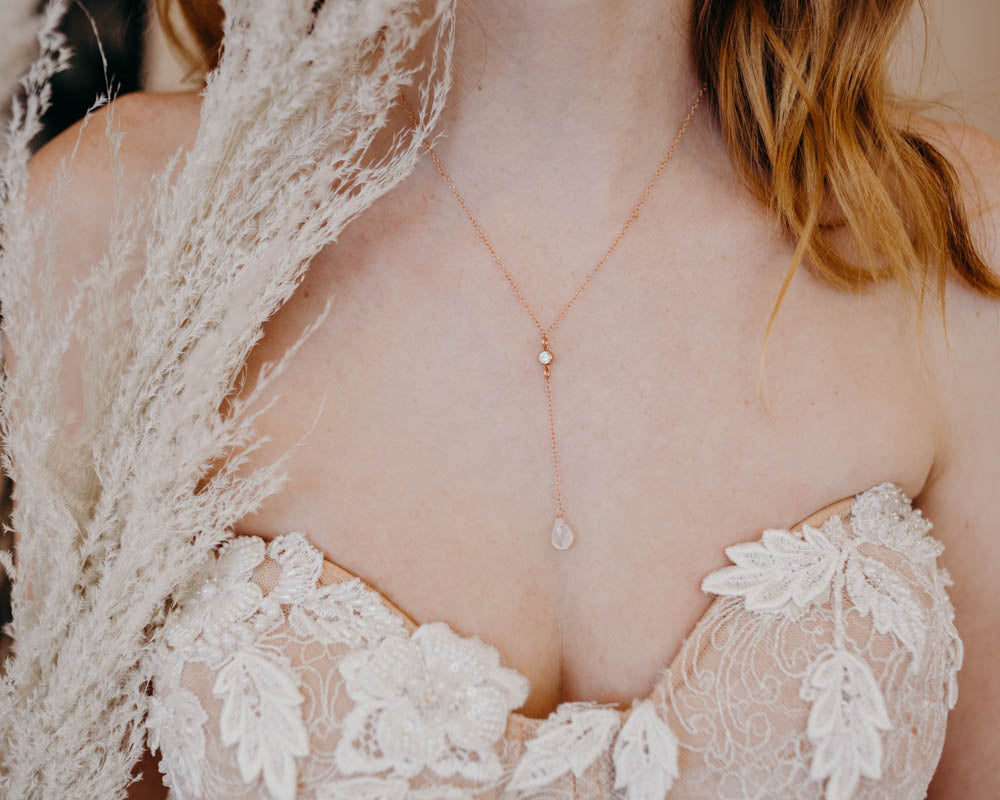 close up of a bride wearing a moonstone necklace