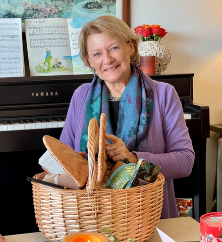 Gift baskets make great housewarming gifts! Fill them with a variety of treats to please any style and budget. Here, my mom enjoys opening a gift basket full of goodies she loved!  