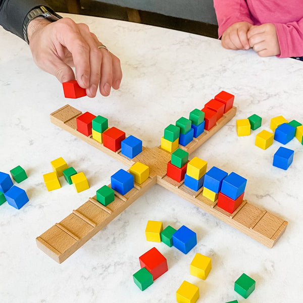 Kilter Family tabletop game where players use physics to balance the blocks on the Kilter. A fun balancing game for kids and adults ages 8 and up.