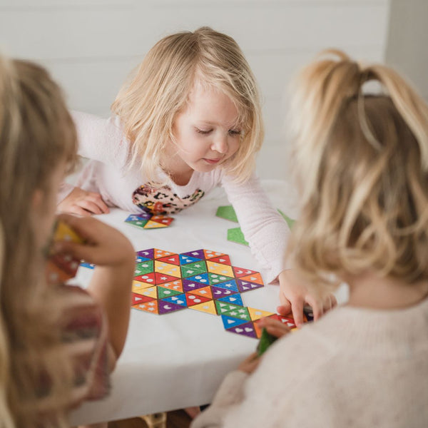 A group of young children playing matching game, Diggers Garden Match. Geometry games for kids.