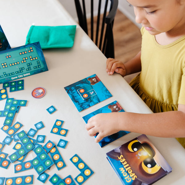 Glow Spotters by SimplyFun is an early addition game which also helps with spatial reasoning for ages 5 and up.