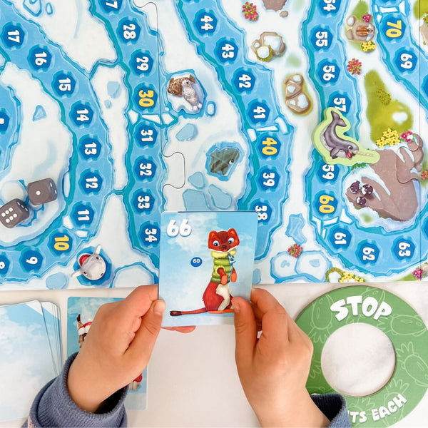 Picture of adding and subtracting game, Arctic Riders. Math card game for kids.