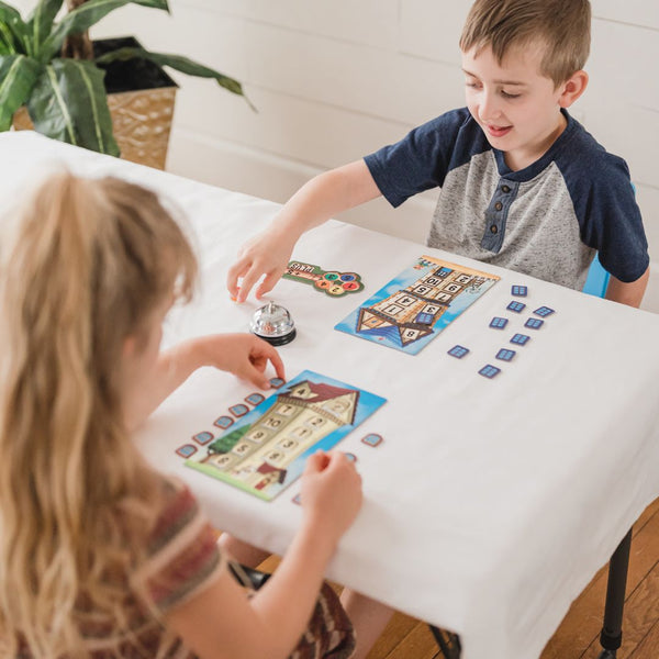 Kids playing math game, Math Room by SimplyFun. How to Avoid Summer Brain Drain or Summer Learning Loss.