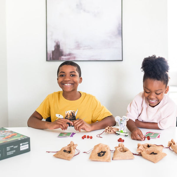 Two kids playing division math game, Acorn Paws by SimplyFun-Microlearning and Educational Gamesicrolearning and Educational Games