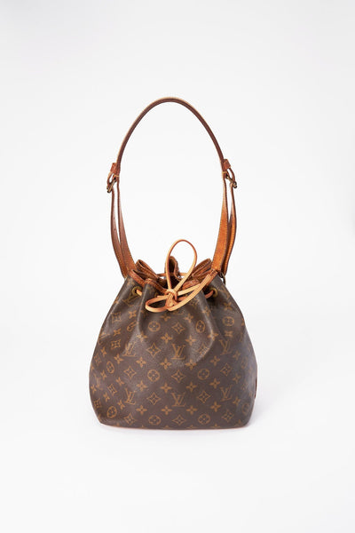 How do I protect the handles and trim of my Louis Vuitton handbag